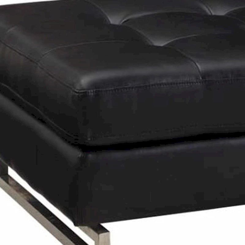 Large Black Tufted Faux Leather Ottoman with Silver Metal Sled Base